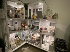 a doll house with all the furniture and accessories in it's display case is shown