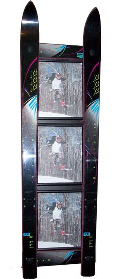 the snowboarder is standing in front of three pictures on the back of his skis