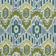 a green and blue pattern on fabric