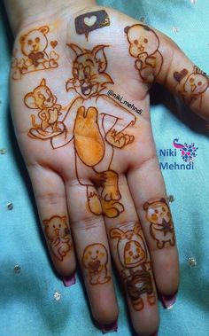 a child's hand with some drawings on it and an animal drawn on the palm