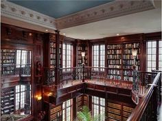 the inside of a library with many bookshelves