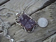 "Large amethyst crystal pendant...handmade forged mounting 2 1/2\" tall with bail by 1 3/8\" wide and 1/2\" thick in places, with a patterned copper bezel, which really sets off the amethyst and the rest is sterling silver 925...the chain is 24\" long, 3mm wide and weights 21.grams also in sterling silver 925...great looking natural amethyst necklace..." 21 Grams, Amethyst Necklace, Amethyst Crystal, Crystal Pendant, Silver 925, Amethyst, On Sale, Copper, 925 Sterling Silver