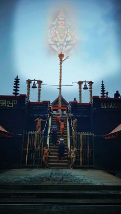 people are standing on stairs in front of a large ship with an image of the hindu god