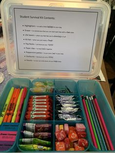 an open plastic container filled with lots of different colored pencils and crayons