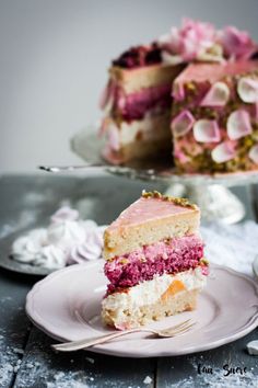 a piece of cake on a plate with a fork in front of it and the rest of the cake behind it