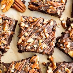 chocolate brownies with pecans and caramel drizzled on the top