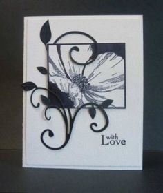 a white card with black swirls and a flower on the front that says, what's love?