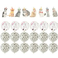 many different kinds of balls with cats sitting on the top one is white and has black dots