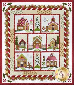 a quilted christmas scene with houses and trees