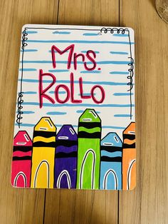 a colorful notebook with the words mrs rollo written on it