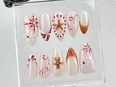 🎄 Festive Elegance Christmas Press-On Nails 🎅✨ Bring the joy of the holiday season to your fingertips with our stunning Christmas-Themed Press-On Nails! Handcrafted with care, these nails combine timeless festive designs with a touch of elegance, making them perfect for any Christmas celebration. 🎁💅 🌟 Key Features & Highlights: 🌟 🎀 Unique Holiday Designs: Featuring adorable gingerbread men, candy canes, snowflakes, and star accents, these nails are a delightful way to celebrate Christmas in style. 🍬❄️ 💎 Luxurious Handcrafted Quality: Each nail is meticulously hand-painted with high-quality materials to ensure vibrant colors and stunning details that will make your nails the center of attention. ✨🎨 ⏱️ Quick & Easy Application: Get salon-quality nails in just minutes with our simpl Gingerbread Christmas Nails, Gingerbread Nail Designs, Nails Winter Wonderland, Gingerbread Nail Art, Nails Candy Cane, Candy Cane Gingerbread, Fake Nails White, Gel Glue