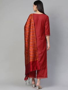 Item Details :- Maroon and rust solid kurta with palazzos and dupatta Maroon solid straight calf length kurta with with gotta patti detail,, has a round neck, three-quarter sleeves, side slits, straight hem Maroon solid palazzos with gotta patti detail, has partially elasticated waistband, slip-on closure, one pocket Rust orange and maroon striped dupatta, has tassels border Package Contains : 1 Kurta, 1 Palazzo & 1 Dupatta [ 3 Piece Set ] Fabric :- Top Fabric : Silk Blend Bottom Fabric : Si Silk Kurta Set, Kurta With Palazzo, Xxxl Dress, Indian Tunic, Gotta Patti, Anarkali Kurta, Rust Orange, Fabric Silk, Skirt Design