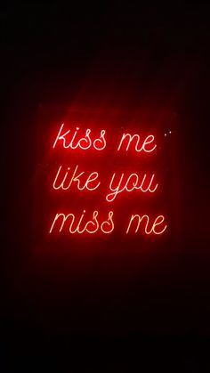 a red neon sign that says kiss me like you miss me