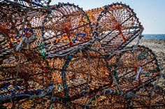 there are many fishing nets on the beach