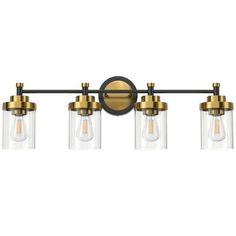 three light vanity fixture with clear glass shades and brass finish on an aged bronze metal frame