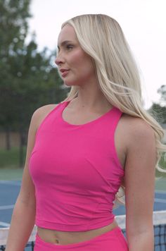 Stay comfortable while you work up a sweat in this stylish pink workout top! Featuring a soft and lined fabric and a racerback design, it will provide you with superior breathability and comfort. Plus, the built-in bra insert provides extra coverage and support. So, you can stay focused on achieving your fitness goals in this butter soft tank. butter soft crop length sport top 84% poly microfiber 16% spandex true to size model is wearing a small Functional Tops With Built-in Padding And 4-way Stretch, Racerback Top With Built-in Bra For Workout, Pink Functional Activewear With Built-in Padding, Pink Functional Sports Bra With Built-in Padding, Athleisure Tank Top With Built-in Bra For Light Exercise, Racerback Tops With Built-in Padding And Medium Support, Stretch Tank Top With Built-in Padding, Racerback Tank Top With Built-in Padding And 4-way Stretch, Athleisure Tops With Built-in Bra For Training