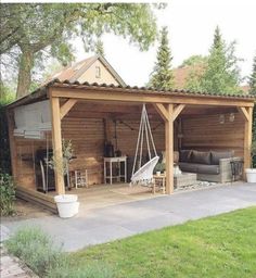 an outdoor living area with a wooden structure