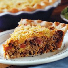 a slice of meat and cheese pie on a plate