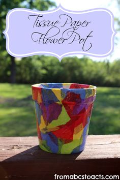 tissue paper flower pot with the words tissue paper flower pot above it on a wooden table