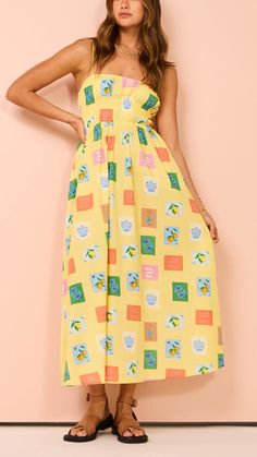 Feel effortlessly stylish in the Yellow Emblem Midi Dress. This lightweight cotton dress features an elasticated waist and fixed shoulder straps, offering comfort and a flattering fit. Perfect for any occasion, from casual outings to garden parties. Garden Parties, Summer Look, Vacation Trips, Midi Dress, Square, Yellow