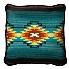 a blue and orange pillow with an arrow design on the front, sitting on a white background