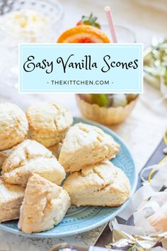 easy vanilla scones on a blue plate with an orange in the background