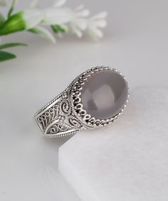 Women Bold 925 Sterling Silver Genuine Authentic Gray Moonstone Artisan Crafted Filigree Oval East West Cocktail Statement Ring Women Jewelry Gifts boxed for Her Material: 925 Solid Sterling Silver Gemstone: Genuine Gray Moonstone 18 mm x 13 mm oval, approximate total carat weight: 10 Ring Face Length: 0.60 inch Ring face width: 0.80 inch Sizes 5-12 It is like all our jewelry nickel free. This ring will come in a designer pouch, put in gift box and a romance card. Free Domestic Shipping It is a Oval Moonstone Ring In Fine Jewelry Style, Oval Cabochon Moonstone Ring, Silver Moonstone Crystal Ring, Silver Oval Moonstone Ring With Natural Stones, Moonstone Oval Cabochon Ring, Elegant Silver Moonstone Ring With Natural Stones, Elegant Silver Rings With Natural Stones, Silver Crystal Ring With Oval Stone Setting, Silver Oval Cabochon Ring