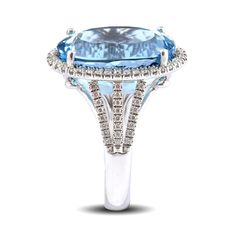 Aquamarines are from the same family as Emeralds and Morganites, giving this gem great luster. Featuring a natural Aquamarine; this cocktail ring is set in 14K white gold. The cool colors of the metal reflecting off the 16.03 carats gemstone, make it a statement piece and will surely flatter any skin tone. It won’t be a surprise if she falls instantly in love with this ring that can complete any look. LCA5384-AQ #277918 Formal White Gold Topaz Ring With Halo, Formal Oval Topaz Ring With Halo Setting, 14k White Gold Oval Topaz Ring, Formal Topaz Diamond Ring With Halo, Formal Diamond Halo Topaz Ring, Formal Halo Diamond Topaz Ring, Luxury Formal Topaz Halo Ring, Formal Oval Topaz Ring With Prong Setting, Formal Topaz Ring With Halo