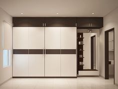 an empty room with white and brown cupboards in the center, some shelves on either side