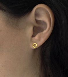 Tiny golden circle earrings, hammered texture , hand made and one of a kind.Measurements:approx 7x7 mm made of brass and gold plated with high quality nickle free plating,now also available in  sterling silver.bigger version:https://www.etsy.com/il-en/listing/197829929/sale-circle-gold-earrings-minimalist?ref=shop_home_active_3 Simple Hammered Round Earrings, Minimalist Hammered Circle Earrings, Hammered Open Circle Earrings For Everyday, Minimalist Jewelry Gold, Minimalist Stud Earrings, Simple Studs, Gold Minimalist Jewelry, Stud Earrings Unique, Earrings Golden