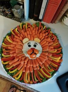 a lion made out of carrots on top of a table