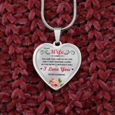 a heart shaped necklace with an inscription on it