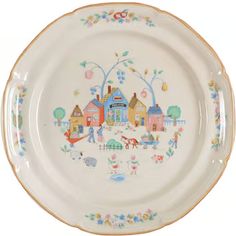 a white plate with houses and flowers painted on the front, along with an orange rim