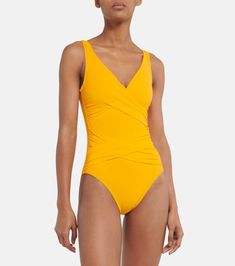 Ruched swimsuit in yellow - Karla Colletto | Mytheresa Fitted V-neck Swimwear With Twist Front, Fitted V-neck Polyamide Swimwear, Solid V-neck Ruched Swimwear, Solid Color Ruched V-neck Swimwear, Ruched V-neck Swimwear, Elegant Ruched Triangle Top Swimwear, Chic Swimwear With Ruched Bodice For Pool, Fitted Swimwear With Ruched Bodice For Beachwear, Fitted Swimwear With Crossover Waistband For Pool