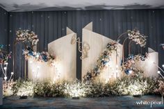 an image of a stage set up for a wedding with flowers and candles on it