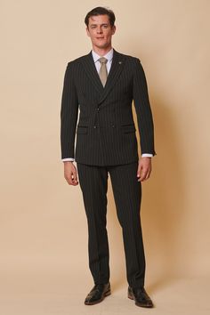 Meet our all new double breasted style, in classic black pinstripe. This exquisite double-breasted two-piece suit combines the timelessness of pinstripes with the sophistication of a tailored fit. The ultimate in luxurious fashion, Rocco is the perfect choice for an elegant look. Model wears size 40R blazer & 34R trousers. Features Slim fit Peak lapel Single back vent Four button cuff Double-breasted blazer fastening Complimentary pocket square Functional inside and outside pockets to the blazer Pinstripe Suit Wedding, Pinstripe Double Breasted Suit Men, Men Blazer Style, Single Breasted Suit Men, Suits Combinations Men, British Suits Men, Graduation Suit Men, Double Breasted Wedding Suit, Double Breasted Pinstripe Suit