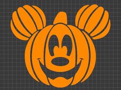 an orange mickey mouse pumpkin with ears