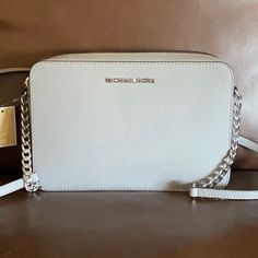 New With Tags Michael Kors Gray Handbag With Silver Hardware. Classic Silver Shoulder Bag With Chain Strap, Classic Silver Bag With Chain Strap, Silver Shoulder Bag With Chain Strap For Travel, Silver Crossbody Shoulder Bag With Silver-tone Logo, Silver Bag With Chain Strap For Travel, Silver Bags With Chain Strap For Travel, Modern Travel Bags With Silver-tone Logo Plaque, Classic Silver Crossbody Shoulder Bag, Modern Travel Bag With Silver-tone Logo Plaque