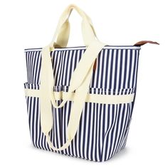 a blue and white striped tote bag on a white background with a brown leather handle