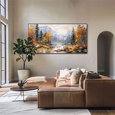 a living room filled with furniture and a painting on the wall