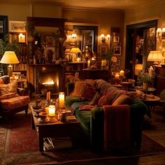 a living room filled with furniture and lit candles