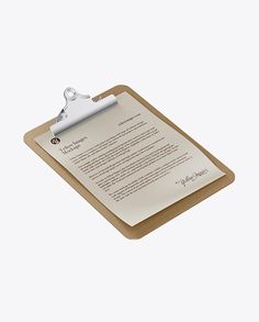 a clipboard with a pen and paper on it