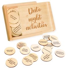 wooden coasters with words on them in a box