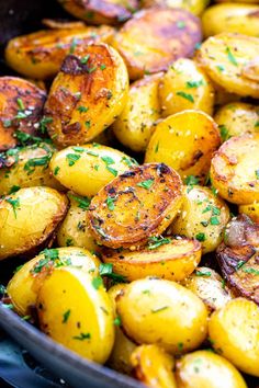 roasted potatoes with parsley in a skillet