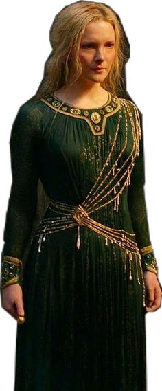 a woman in a long green dress with gold trims on her head and shoulders