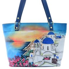 Busy day ahead? Take this Anuschka tote along for the ride! No matter where your plans take you, this large sized tote bag has all the space you could possibly need. It closes with a secure zip top design and houses plenty of pockets for organization. Featuring Anuschka's hand-painted leather designs, you'll love toting this artsy double handle bag along with you! Hand Painted Tote Shoulder Bag For Everyday, Everyday Hand Painted Tote Shoulder Bag, Hand Painted Shoulder Bag For Travel, Artistic Hand Painted Travel Bags, Hand Painted Tote Shoulder Bag For Daily Use, Rectangular Hand Painted Travel Shoulder Bag, Hand Painted Blue Bags For Everyday Use, Daily Use Hand Painted Tote Shoulder Bag, Artistic Leather Travel Bag