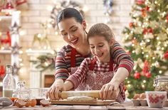 mother and daughter making christmas cookies together