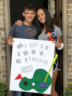 a man and woman holding up a sign that says, what's a birdie if you don't want to be a hole - in one?