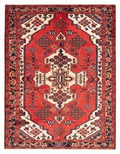 an antique persian rug with red and blue designs on the center, surrounded by smaller geometric shapes