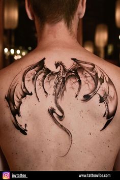 a man with a dragon tattoo on his back